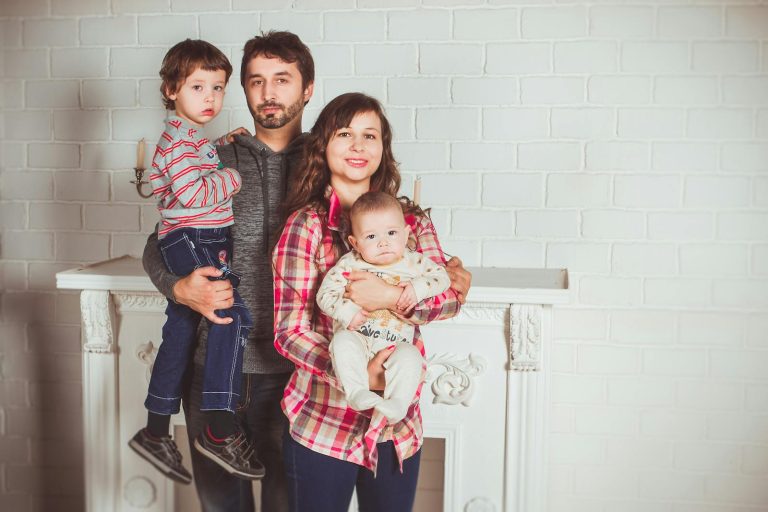 Indian family at airport preparing to relocate abroad with children